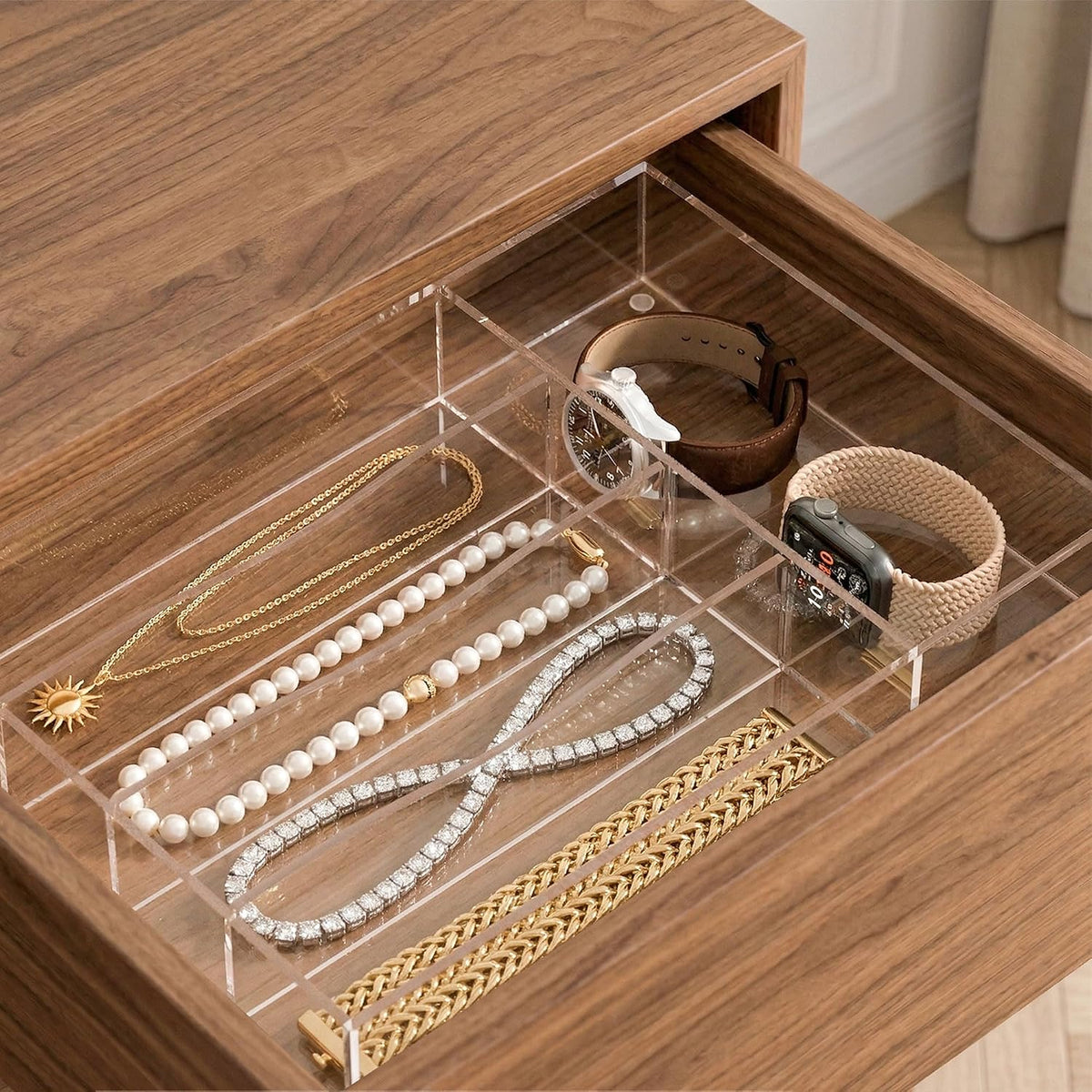 Clear cutlery organizer arranged in a drawer